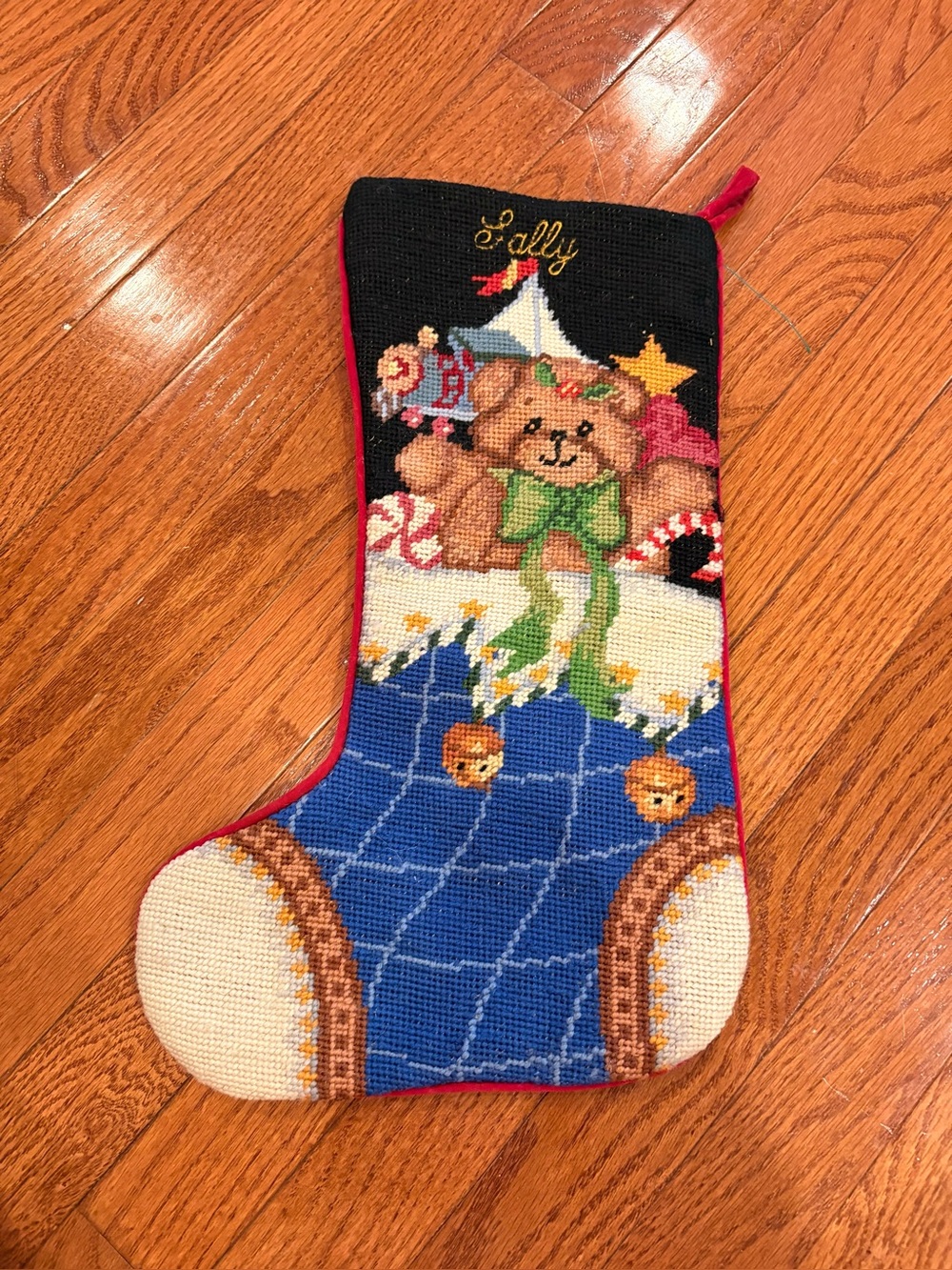 Vintage wool needle-point Christmas stocking featuring an adorable teddy bear.